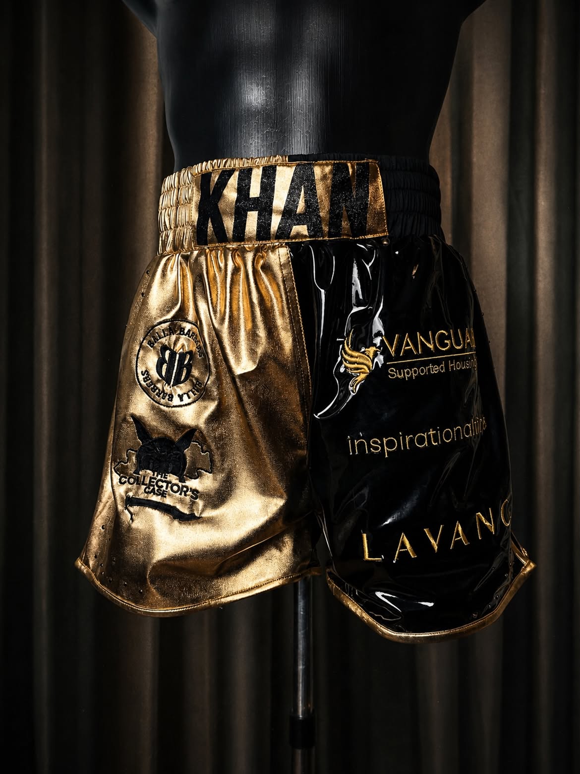 Black and gold metallic Muay Thai shorts for Idris Khan