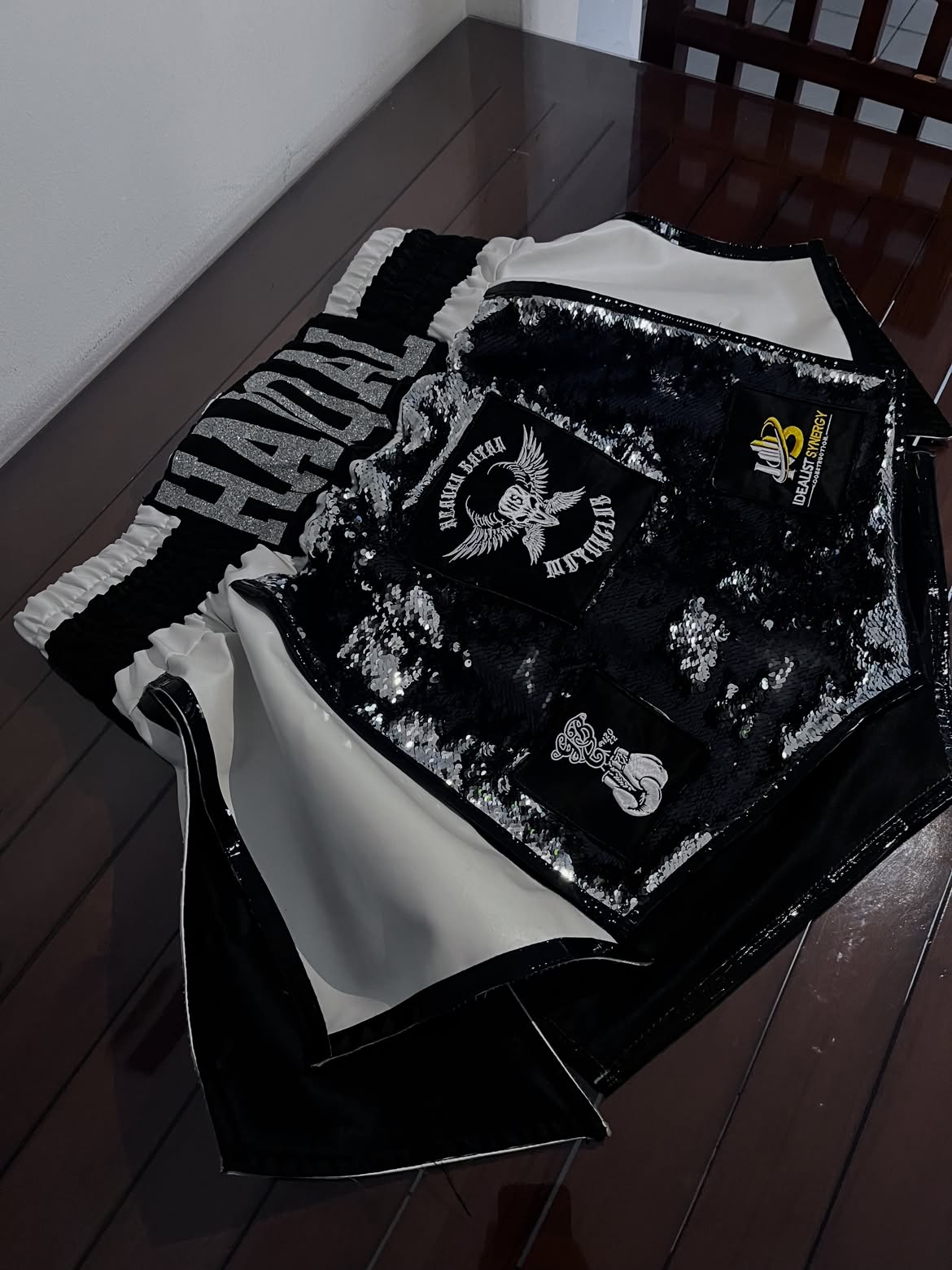 Black and white sequin boxing trunks with custom patches.
