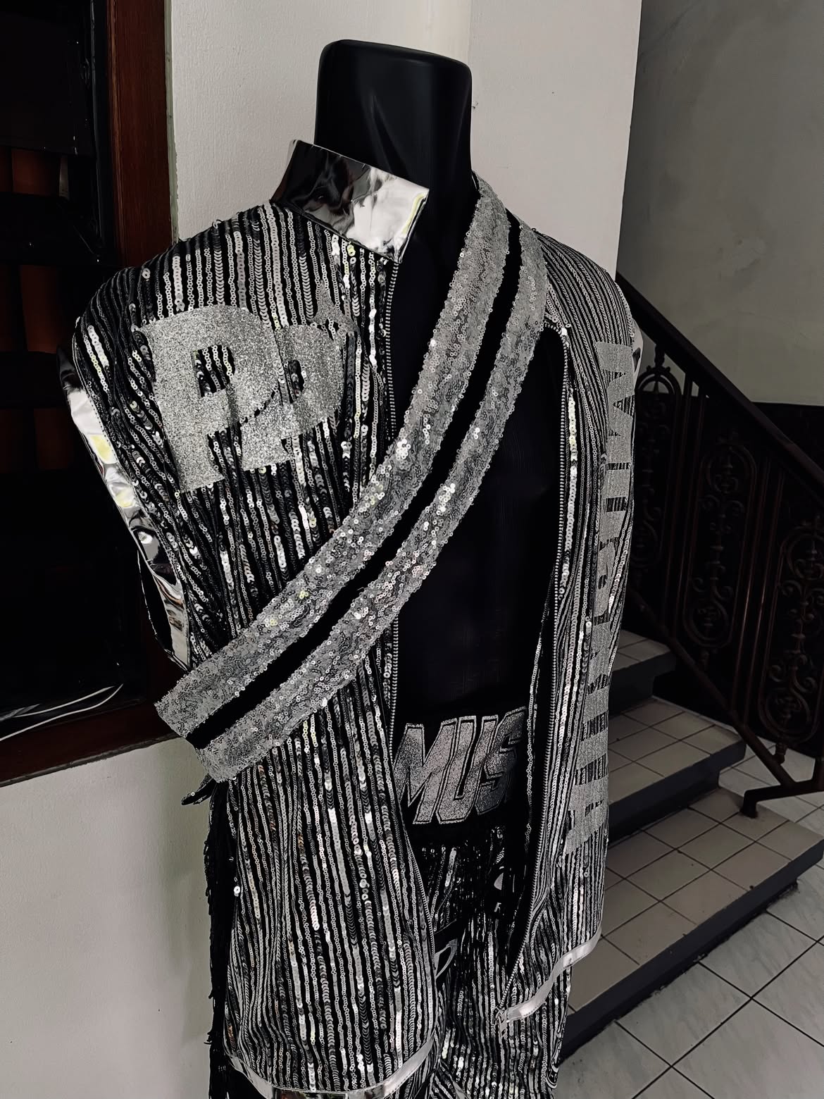 Black and silver Muskita walkout jacket with sequin panels.