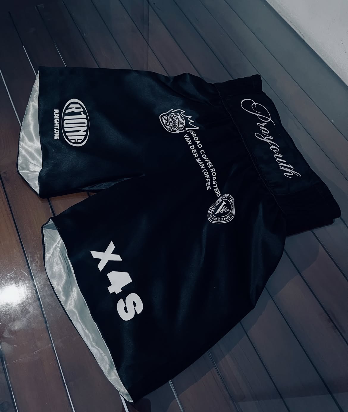 Black Ranch One boxing shorts with silver side panels and custom graphics.