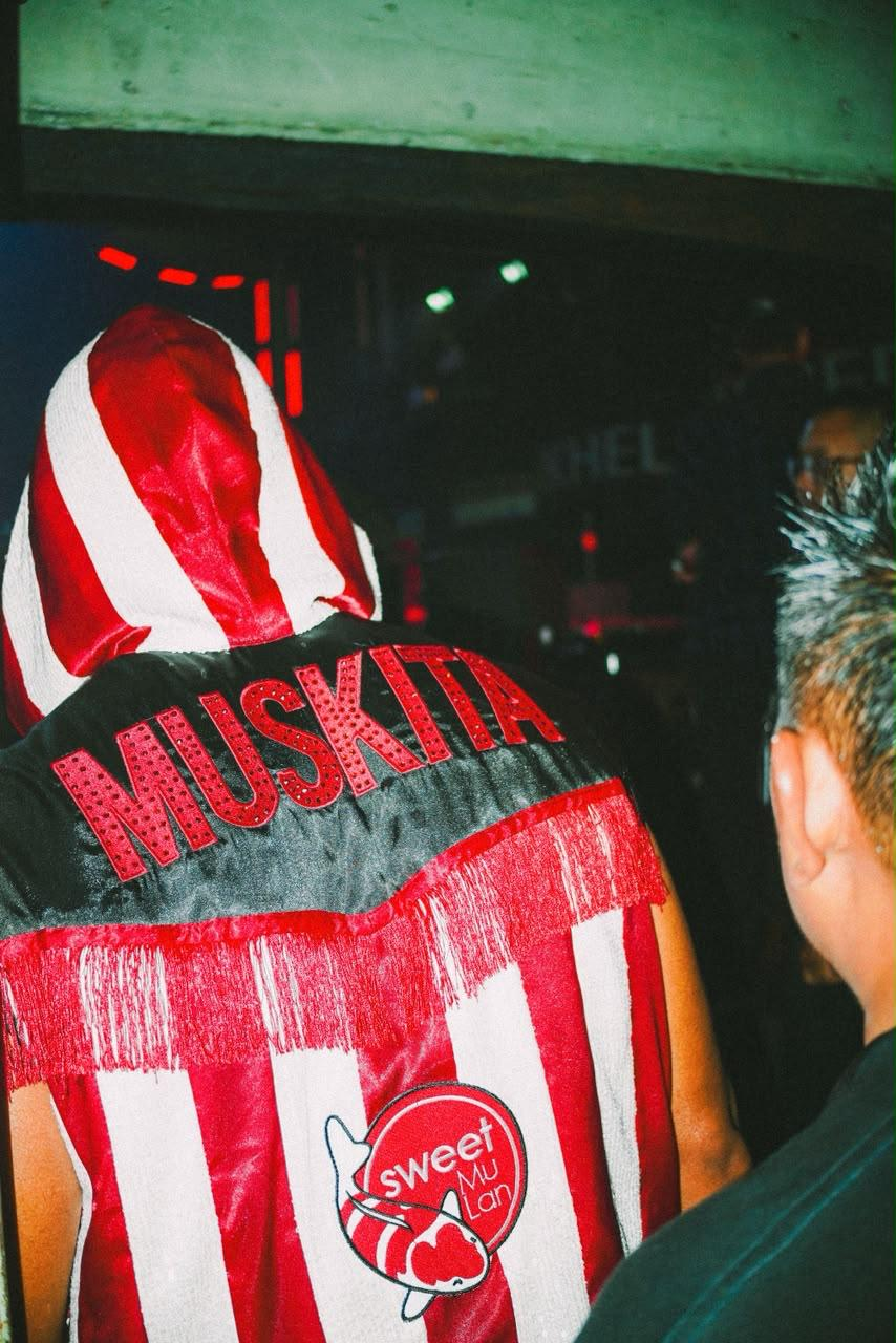 Fighter walking out in a red, white and black custom Primal Customs 'Muskita' fringe robe.